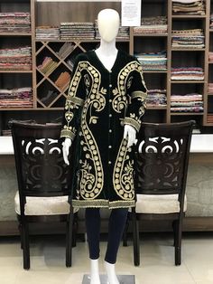 Never fading, the timeless traditional embroidered coat will make you look trendy and stylish no matter what. Pair it up with denim, skirt, trouser, or even a flowing dress to evoke chic in you.Product Details- Condition: Brand New (made to order)- Handmade- Style: Coat- Fabric: Fine Velvet- Embroidery: Dori & Tilla Work- Base Color: Green- Embroidery Color: Gold- Fully Lined from Inside- Features Pockets on both sides- Length: 42" (107 cms approx)- Care Instructions: Dry Clean Only**If you Long Winter Outerwear With Intricate Embroidery, Winter Long Outerwear With Intricate Embroidery, Winter Outerwear With Gold Embroidery And Long Sleeves, Fitted Winter Outerwear With Gold Embroidery, Festive Winter Outerwear With Gold Embroidery, Festive Velvet Long Sleeve Outerwear, Embroidered Green Outerwear For Winter, Embroidered Green Winter Outerwear, Festive Green Embroidered Outerwear