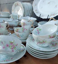 a table topped with lots of plates and bowls