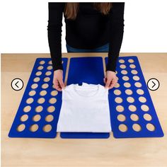 a woman is making t - shirts out of cookie dough on top of an exercise mat