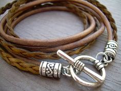 This triple wrap double strand leather bracelet is sure to be one of your favorites. Wrap these rich strands of light antique brown around your wrist and off you go! Materials: Lead and Nickel Free - Aged Silver Toned Alloy Metal Components, Fine Grade Imported 3 and 5 mm round and flat leather cords. Each piece comes with a brand hang tag and a black drawstring pouch. Size: Available to fit a firm wrist measurement of 6/6.5/7/7.5/8 /8.5 inches - wraps three times around the wrist. Need a differ Vintage Brown Wrap Bracelet Gift, Vintage Brown Wrap Bracelet, Brown Leather Strap Wrap Bracelet Gift, Adjustable Brown Multi-strand Wrap Bracelet, Brown Bohemian Leather Bracelet For Everyday Use, Bohemian Brown Leather Bracelet For Everyday Use, Brown Bohemian Leather Bracelet For Everyday, Adjustable Brown Bracelets With Lobster Clasp, Brown Waxed Cord Wrap Bracelet As Gift