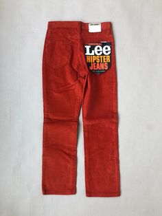 Stunning pair of vintage corduroy pants in fiery red, featuring a mid-rise waist and slim, straight-cut legs. Locally sourced from a closed-down jeans store, these pants retain their original Lee manufacturing tag from the early 1970s. Crafted from 100% cotton in the USA, they close with a Talon 42 zipper and a Lee snap button. An exceptional vintage find in excellent condition. We recommend that you buy your fit by following these measurements, Waist: 66 cm / 26" Inseam: 66 cm / 26" Label size Cord Jeans, Hipster Jeans, Jeans Store, Vintage Kids, Fiery Red, Age 12, 70s Vintage, Kids Pants, Corduroy Pants