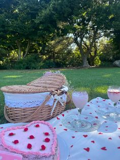 a picnic table with cake and wine glasses