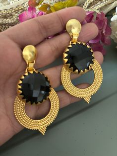 Simply Stylish and Elegant! A gorgeous pair of earrings for the gemstone's lovers! Purely handmade with love by our skilled Indian craftsmen from Jaipur  Dimensions: Weight per Pair:  34 grams Length of earrings: 7 cm Width of earrings: 4 cm  Product Details: Material: Handcrafted in brass with a gold-plated base and natural gemstones.  Black onyx Elegant Metal Earrings For Gift, Handmade Elegant Chandbali Earrings, Elegant Round Danglers As Gift, Elegant Handmade Chandbali Earrings, Elegant Danglers As A Gift, Elegant Chandbali Crystal Earrings For Gift, Elegant Handmade Chandbali Danglers, Metal Clip-on Crystal Earrings As Gift, Metal Clip-on Crystal Earrings For Gift