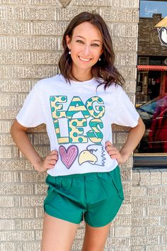 Rep your Eagles in this simple little white graphic with a fun hand drawn Eagles print across the front! Great for teachers, coaches, and students! unisex fit crew neck 50% cotton, 50% polyester Southern Roots Boutique112 W. Main St. Paragould, AR *Please allow 5-7 business days processing time for this item to be shipped/picked up. White School Spirit Top For Spring, White Casual Game Day Top, School Spirit T-shirt For Game Day In Spring, Casual White Tops For Game Day, White Graphic T-shirt For Game Day, School Spirit Graphic Print Tops For Spring, Spring Graphic Print Top For School Spirit, Casual Sublimation Design With Graphic Print For Spring, Casual Cotton Sublimation Design With Logo Print