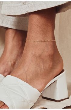 Elevate your everyday looks with a delicate chain anklet playfully punctuated with flattened links for a subtle dimensional twist. 9 1/4" length 14k-gold fill Made in the USA Dainty Gold Chain Anklet, Permanent Anklet, Anklet Designs, Gold Anklet, Delicate Chain, Chain Anklet, Anklet Jewelry, Pretty Jewellery, Everyday Look