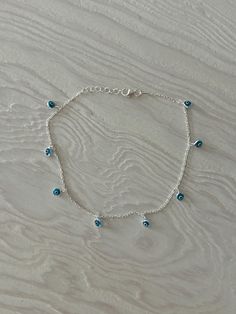 Waterproof and tarnish resistant, our Evil Eye anklet is perfect for everyday wear! Information: 🧿 Sterling Silver (925 stamped)  🧿 4MM Glass Evil Eye Charms 🧿 Length: 10" | Adjustable 🧿 Hypoallergenic 🧿 Tarnish Resistant 🧿 Waterproof Our anklet is simply perfect and so dainty, it flows beautifully on the ankle. Each charm is painted with enamel, giving the eye a 3D look - making it highly detailed. Made with Sterling Silver and high quality materials, our anklet is perfect for daily wear and it's very long lasting. Our anklet is adjustable, you can wear it from 9" to 10" allowing you to find the perfect fit.  For centuries, Evil Eyes have been known as a talisman for protection, it's believed that it can protect the wearer from negative energies and the evil eye, keeping them safe a Evil Eye Bracelet Silver, Evil Eye Anklet, Anklet Silver, Glass Evil Eye, Charm Anklet, Silver Anklet, Sterling Silver Anklet, Blue Evil Eye, Evil Eye Charm