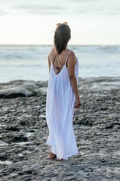 The Amalie maxi is your dream dress for island adventures and real life alike. With its playful ruffle neckline and a sassy deep V back with adjustable straps, it's designed to boost your confidence. This maxi dress doesn’t just look fabulous—it’s practical too, with pockets big enough for your beach finds or fidgety hands. Whether you’re beach-bound or bar-hopping, this maxi cover up ensures you do it all in style AND comfort. Machine washable; Hang to dry: Gentle cycle for long-lasting wear. P Breezy V-neck Beach Cover-up, Flowy Unlined Cover-up For Vacation, Flowy White Breezy Cover-up, White V-neck Breezy Cover-up, White Flowy Cover-up For Vacation, Bohemian White V-neck Swimwear, Unlined V-neck Maxi Dress For Beach, V-neck Beach Dress For Beach Wedding, White Breezy Cover-up For Vacation