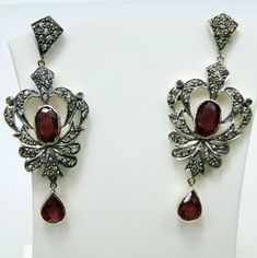 ITEM-VICTORIAN DIAMOND Ruby, 14 CT GOLD & STERLING SILVER EARRINGS. SIZE-5.5 /2.25 CM, TOTAL WEIGHT-13 GRAMS, Ruby WEIGHT-12 CT, OLD CUT FLAT ROUND DIAMOND WEIGHT-3 CT, 14 CT GOLD WEIGHT-3 GMS ALL STONES ARE NATURAL AND OF HIGH QUALITY. MATERIAL-14 CT SOLID GOLD , SILVER, DIAMOND ,Ruby. Luxury Hallmarked Oval Diamond Earrings, Luxury Ruby Gemstone Earrings, Luxury Hallmarked Ruby Earrings, Victorian Diamond Earrings In White Gold With 17 Jewels, Victorian White Gold Diamond Earrings With 17 Jewels, Luxury Silver Chandelier Earrings With Rose Cut Diamonds, Elegant Round Rose Cut Diamonds, Ruby Gemstone Diamond Earrings In Fine Jewelry Style, Fine Jewelry Ruby Diamond Earrings