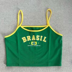 Green and yellow Brazil top Y2k sporty Brazil stretchy crop top Excellent condition Spaghetti straps Stretchy material Size small Cheap Sleeveless Yellow Tops, Sporty Cotton Crop Top With Tank Straps, Green Y2k Cami Top, Y2k Style Green Crop Top For Streetwear, Trendy Sports Crop Top Tank, Trendy Summer Sports Crop Top, Trendy Crop Top Tank Top For Sports, Casual Crop Top Sports Bra For Summer, Casual Sports Bra Crop Top For Summer