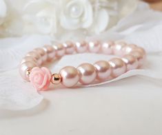 Flower girl bracelet, blush pink flower girl gift, pink rose bracelet, pearl bracelet, blush pink pearl bracelet, jr bridesmaid gift This blush pink flower girl bracelet is made with blush pink color little glass pearls (8 mm) and soft pink resin rose charm. This stretch pearl bracelet is perfect gift for your flower girls, jr bridesmaids or bridesmaids. Please visit my store to see the other wedding jewelry https://www.etsy.com/shop/asteriasbridal Pink Pearl Bracelet For Wedding, Delicate Pink Bracelets For Wedding, Delicate Pink Bracelet For Wedding, Delicate Pink Pearl Bracelet For Wedding, Feminine Rose Gold Bracelets For Wedding, Adjustable Pink Pearl Bracelet For Weddings, Dainty Pink Beaded Bracelets For Wedding, Pink Adjustable Bracelets For Bridesmaids, Feminine Pink Pearl Bracelets