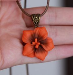 Burnt orange statement necklace Hibiscus necklace pendant | Etsy Handmade Orange Flower-shaped Jewelry, Handmade Clay Flower Jewelry, Unique Red Polymer Clay Necklace, Red Polymer Clay Necklace For Gift, Handmade Orange Resin Necklace, Unique Orange Flower Shaped Jewelry, Unique Orange Flower-shaped Jewelry, Orange Clay Jewelry For Gifts, Unique Clay Necklace For Gifts