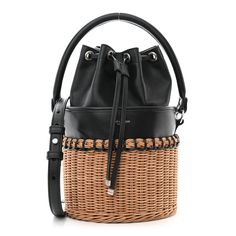 This is an authentic SAINT LAURENT Calfskin Wicker Small Bahia Bucket Bag in Black. This classic hobo bag is crafted of rich black calfskin leather and wicker. The bag features an optional shoulder strap and an optional handle. The top cinch cord opens to a spacious black leather interior. Quilted Toys, Bag Saint Laurent, Gold Sand, Saint Laurent Bag, Wallet Chain, Black Cross Body Bag, Chain Bags, Leather Interior, Hobo Bag