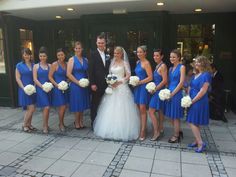 a bride and groom with their bridal party