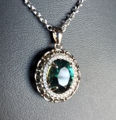 "Stunning Alexandrite Rococo Sterling Necklace. Finally Got These 8x10mm Premium Synthetic Color Change From Purple To Green-Blue Gem,Beautiful! Watch WHOLE Video, Shows Incandescent To Natural Light Changes! 925 Sterling Sil er Necklace with Crystal Accents and Sterling 18\" Chain. Gift Box Included. Great Gift!" Formal Round Pendant Necklace Stamped 925, Oval Halo Setting Necklace For Gift, Oval Halo Setting Necklace As Gift, Classic Silver Necklace For May Birthstone, Oval Necklace With Halo Setting As Gift, Anniversary Oval Pendant Necklace Stamped 925, Silver Necklace With Emerald Oval Pendant, Silver Oval Pendant With Emerald For May Birthstone, Oval Pendant Necklace With Halo Setting