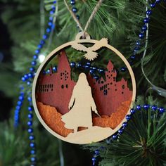 a wooden ornament hanging from a christmas tree