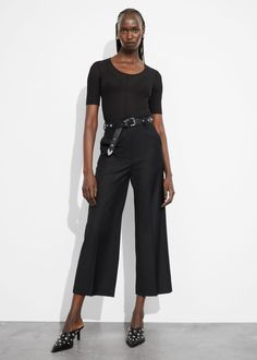 Tailored high-waist trousers with a cropped silhouette. Featuring press creases.• Belt loops• Zip fly with hook and bar closure• Duo slanted side pockets• Duo back pockets• Length of inseam:68.5cm / 27" (EU 36 / UK 8 / US 4) Edgy Belted Spring Bottoms, Edgy Belted Bottoms For Spring, Sleek Trousers With Belt Loops, Wide Leg Pants With Belt Loops For Summer Workwear, Summer Wide Leg Pants For Workwear With Belt Loops, Spring Evening Cropped Bottoms, Black Cropped Bottoms With Pockets, Cropped Black Bottoms With Pockets, Chic Cropped Bottoms For Formal Occasions