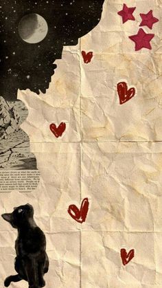 a black cat sitting on top of a piece of paper with hearts drawn on it