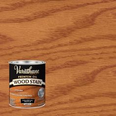 a can of wood stain sitting on top of a wooden table