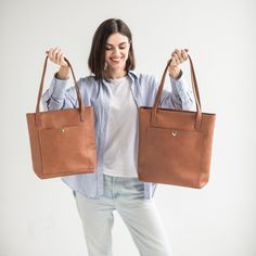 This handmade women tote bag is produced of cowhide leather. It has one pocket inside. The bag has a high-quality zipper that secures your belongings. It holds the shape perfectly and you may be confident that your personal things like cell phone, tablet, lap-top are safe. This bag is simple, reliable, and durable. Its universal look allows to use the tote bag for various purposes. One may take the bag to the work, shopping, meeting, or walk and feel comfortable with it at any conditions. SIZE and DIMENSIONS:       〰️ SMALL 〰️ Height: 12 inches (30 cm) Width (the top): 12.6 inches (32 cm) Width (the bottom): 9 inches (23 cm) Depth: 4.3 inches (11 cm)      〰️ MEDIUM 〰️ Height: 13.4 inches (34 cm) Width (the top): 14.6 inches (37 cm) Width (the bottom): 11 inches (28 cm) Depth: 4.3 inches (1 Brown Satchel With Snap Closure For Daily Use, Everyday Use Shoulder Bag With Smooth Grain, Everyday Tote Satchel With Snap Closure, Everyday Tote Bag With Snap Closure, Everyday Faux Leather Bags With Snap Closure, Everyday Use Tote Satchel With Snap Closure, Everyday Brown Satchel With Interior Card Slots, Everyday Smooth Grain Bags, Everyday Use Faux Leather Shoulder Bag With Smooth Grain