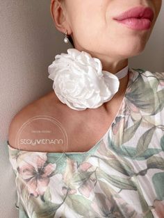 💕 Introducing our handmade satin silk flower choker, perfect for adding a touch of feminine elegance to any outfit. The soft, smooth satin silk flower is delicately fixed onto a velvet ribbon, creating a beautiful contrast of textures. The ribbon is adjustable to fit comfortably around your neck, ensuring a perfect fit for any size. The choker doesn't have a clasp so it's freely adjustable to your neck size. You can tie it comfortably for you, and the bow at the back will give you romance and f White Flower Bridal Necklace For Wedding, White Floral Bridal Necklace For Wedding, Adjustable Elegant Flower Necklace, Adjustable Flower Necklace For Wedding, Elegant Adjustable Flower Necklace, Adjustable Flower Charm Necklace For Wedding, Adjustable Necklace With Flower Charm For Wedding, Adjustable Flower Charm Necklaces For Wedding, Elegant Adjustable Flower Necklace For Wedding