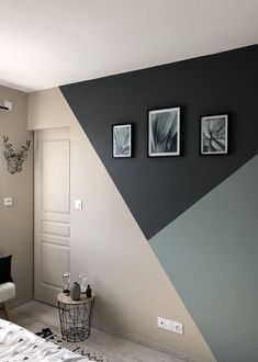 a bedroom with black and white decor on the walls