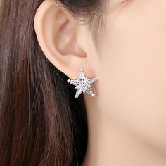 Material: Copper, Gold Plated, Cubic ZirconiaSize: 2.2cm by 2.2cm Weight: 3.8g per pairDesign: Crystal Star Stud EarringsColor: White, Silver White Star-shaped Cubic Zirconia Earrings, Star-shaped Cubic Zirconia Earrings For Party, Star Shaped Cubic Zirconia Earrings For Party, Silver Star-shaped Cubic Zirconia Earrings, Silver Star Clip-on Earrings For Gift, Silver Star-shaped Crystal Earrings For Pierced Ears, Silver Star Crystal Earrings, Silver Star Crystal Earrings For Pierced Ears, Travel Inspired Jewelry