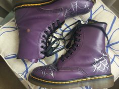 One pair of Dr Martens smooth leather purple vintage boots, customised recently with silver web patterns. Made in England about 20 years ago.  U.K. 4 EU 37 US 6 In fairly good vintage condition, but not perfect.  These Docs have been painted with a silver/ black spider web pattern on toes and heels. The stitching has come loose on the back of the left boot and both boots have a discoloured circle just above the ankle area...motorbike riding, I think. Minor scuffs and marks: they could do with a shine. The Air Wair soles are good, only a little wear on heels. Yellow stitching is still bright. Minor creasing over the toe area. Good for years and years.  From a smoke and pet-free home.  Free shipping wherever you are Hand Painted Doc Martens, Motorbike Riding, Spider Web Pattern, Web Pattern, Web Patterns, Purple Vintage, Purple And Silver, Dr Martens Boots, Black Spider