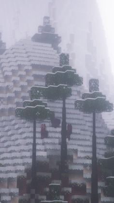 the trees are covered with snow in front of a building that looks like it is made out of blocks