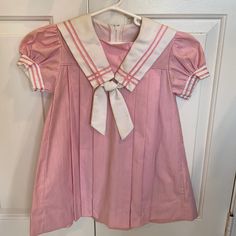 Little Girl’s Pink And White Vintage Sailor Dress. Pleated Dress With White Sailor Collar And Pink Trim. Never Worn!! Sailor Collar Cardigan, Pink Cotton School Dress, Pink Cotton Dress For School, Classic School Dresses For Spring, Fitted Pink Dress For School, Preppy Pink School Dress, Classic Dresses For School In Spring, Classic Spring Dresses For School, Pink Preppy Cotton Dress