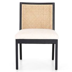 a black and white chair with wicker back