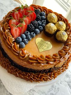 a cake with chocolate and fruit on top