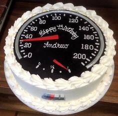 a birthday cake with a speedometer on it