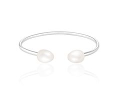 7.5-8mm White Cultured Freshwater Silver Bracelet. Measures approximately 0.25" wide and length 6.5" White Stackable Bracelets For Formal Occasions, Modern Adjustable Pearl Bracelet For Formal Occasions, Silver Pearls, Fresh Water, Freshwater Pearls, Silver Bracelet, Bracelet, Silver, White