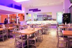 the inside of a restaurant with tables and chairs