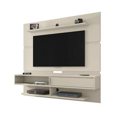 an entertainment center with a flat screen tv mounted on it's side, and shelves below