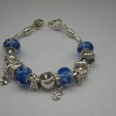 Charm Bracelet Royal Blue And White Color Size Is Approximately 8" Long Elegant Blue Nickel Free Charm Bracelet, Elegant Blue Bangle Charm Bracelet, Casual Blue Metal Bracelets, Blue Nickel-free Charm Bracelet As Gift, Nickel-free Blue Charm Bracelet For Gift, Nickel-free Blue Charm Bracelet Gift, Blue Nickel-free Charm Bracelet With Round Beads, Blue Metal Charm Bracelet With Lobster Clasp, Blue Metal Bracelets With Round Beads