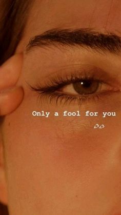 a woman's eye with the words only a fool for you written on it