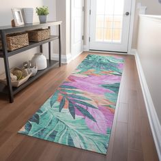 a colorful rug on the floor in front of a door