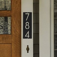 a house number sign on the front door