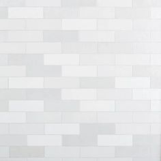 a white tiled wall with no one in it