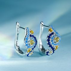 In a stunning display of style and craftsmanship, these earrings are brought to you. A combination of light blue, midnight blue, and yellow gold stones, the earrings are a premium miniature version of Van Gogh's timeless Starry Night painting. This piece of work reminds us to trust our dreams and not believe the critics of the world. "There is always hope, even in the darkest of times." So trust your dream and let this alluring jewelry make a statement.Carat Weight: 1.314 ctStone Size: 1.5,1.3,1 Blue Gemstone Cluster Earrings For Anniversary, Blue Fine Jewelry Earrings For Anniversary, Blue Gemstone Cluster Earrings Fine Jewelry, Sapphire Multi-stone Earrings Fine Jewelry, Blue Sapphire Cluster Earrings For Gift, Blue Sapphire Earrings For Pierced Ears, Blue Cubic Zirconia Earrings With Sparkling Stones, Blue Fine Jewelry Cluster Earrings For Anniversary, Blue Drop Cluster Earrings For Gift