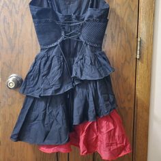 Rare! Black With Red Ruffle. I Can't Find Any Promo Pics Of This, Just The Plain Black Or Red.Cincher Side Panels, Lace Ties Front And Back, Zipper Closure. No Holes, Stains Or Damage. Never Worn. Nwt. M Red Gothic Dress For Summer, Fitted Red Gothic Mini Dress, Red Fitted Gothic Mini Dress, Red Gothic Mini Dress For Summer, Red Gothic Dress For Spring, Gothic Cotton Dress With Ruffles, Red Gothic Spring Dresses, Gothic Red Summer Mini Dress, Red Ruffled Mini Dress For Costume Party