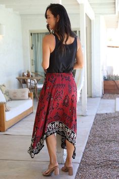 Nostalgia Lightweight handkerchief midi skirt with ethnic print and border contrast. Elastic waist and decorative tie. Nice dark color wine is unusual hard to find catch. Go for it! Color: Wine Sizes: S-M-L-XL Fit is true to size 100% Rayon, hand wash cold, imported K1/N6E22-FQ59 Bohemian Skirt With Asymmetrical Hem And Lining, Bohemian Skirt With Asymmetrical Hem And Lined Detail, Bohemian Handkerchief Hem Skirt, Bohemian High-low Maxi Skirt, Bohemian High-low Hem Flowy Maxi Skirt, Bohemian Flowy Maxi Skirt With Handkerchief Hem, Bohemian Maxi Skirt With Asymmetrical Hem, Bohemian Handkerchief Hem Festival Bottoms, Bohemian Lined Skirt With Handkerchief Hem