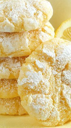 some powdered sugar covered pastries are stacked on top of each other in this close up photo