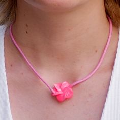 Single Strand 16 inch Pink or White Cord Choker Necklace with matching color Fimo Plumeria Flower slider pendant In stock. Shipped daily from Florida USA Pink Flower-shaped Necklaces For Mother's Day, Pink Adjustable Flower Shaped Necklace, Adjustable Pink Flower-shaped Necklace, Pink Flower Pendant Necklace For Valentine's Day, Adjustable Flower-shaped Jewelry For Valentine's Day, Adjustable Flower Shaped Jewelry For Valentine's Day, Valentine's Day Pink Flower Pendant Necklace, Pink Adjustable Flower Pendant Necklace, Adjustable Jewelry With Flower Charm For Valentine's Day