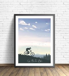 a poster with the silhouette of a man riding a bike