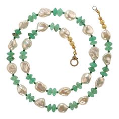 This is part of Chairish’s Fine Jewelry assortment.  24 Inch white iridescent keshi pearl and green glowing chrysoprase necklace.  This glorious necklace combines the best of both pearl and gemstone.  The translucent green chrysoprase is accented with green 2mm green quartz rondelles. The necklace is secured with a gold vermeil diamond lobster claw clasp. Elegant Chrysoprase Gemstone Beads Necklaces, Green Pearl Pendant Necklace For May Birthstone, Elegant Chrysoprase Gemstone Beads Necklace, Green Necklaces With Pearl Pendant For May Birthstone, Elegant Green Chrysoprase Beaded Necklaces, Elegant Green Pearl Necklace With Natural Stones, Elegant Green Single Strand Pearl Necklace, Green Necklace With Pearl Pendant And Round Beads, Green Necklaces With Pearl Pendant And Round Beads