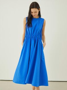 This lovely dress features voluminous, drapery silhouette in maxi length. It is accentuated with unique shirred details at waist.  - Intended for a loose fit- Lightweight cotton fabric- Airy, crisp texture- Casual side pockets and back zip fastenings- Cute and feminine feel Spring Midi Dress With Pleated Waist And Voluminous Skirt, Cotton Dress With Pleated Waist And Voluminous Skirt, Cotton Maxi Dress With Gathered Waist For Daywear, Chic Dress With Gathered Waist And Voluminous Skirt, Spring Dress With Voluminous Skirt And Gathered Waist, Cotton Ruched Maxi Dress, Cotton Maxi Dress With Ruched Details, Spring Ruched Maxi Dress With Voluminous Skirt, Ruched Cotton Maxi Dress