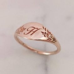 Elegant and unique 14k gold monogram signet ring, Vintage style floral initial ring, personalized engraved signet ring. * Band width: 1.5 mm, wide part width: 7 mm* Thickness: 1.5 mm* Available in 14K or 18K YELLOW, WHITE and ROSE gold.   The price listed is for 14K please contact me for 18K pricing.* Sizes vary from 5 US to 9 US, including half sizes.    Please choose your size upon checkout.* Please choose a the letter you would like to be engraved and mention in note to seller.* Please choose Elegant Rose Gold Engraved Ring Stamped 14k, Elegant 14k Gold Engraved Initials Ring, Elegant 14k Gold Initial Ring With Engraving Option, Vintage Engraved Ring With Initials For Promise, Vintage Engraved Promise Ring With Initials, Vintage Personalized 14k Gold Engraved Ring, Vintage Engraved Initials Promise Ring, Luxury Rose Gold Signet Ring For Wedding, Luxury Rose Gold Wedding Signet Ring