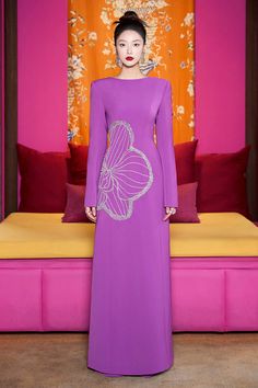 Experience the ultimate luxury in our Ao Dai. Crafted with the finest materials, this elegant dress flows effortlessly for a timeless and sophisticated look. The boat neck adds a touch of exclusivity while the velvet and satin fabrics provide a soft and opulent feel. Make a statement in style with this. Length: 150cm (Ao Dai), 110cm (Pants) Beaded Clothes, Beads Clothes, Satin Fabrics, Mean Blvd, Hijabi Outfits, Satin Maxi, Satin Maxi Dress, Ao Dai, Elegant Dress